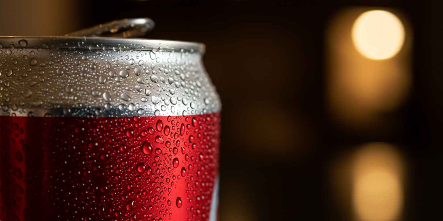 Condensation on a cold beverage can with a slow push in